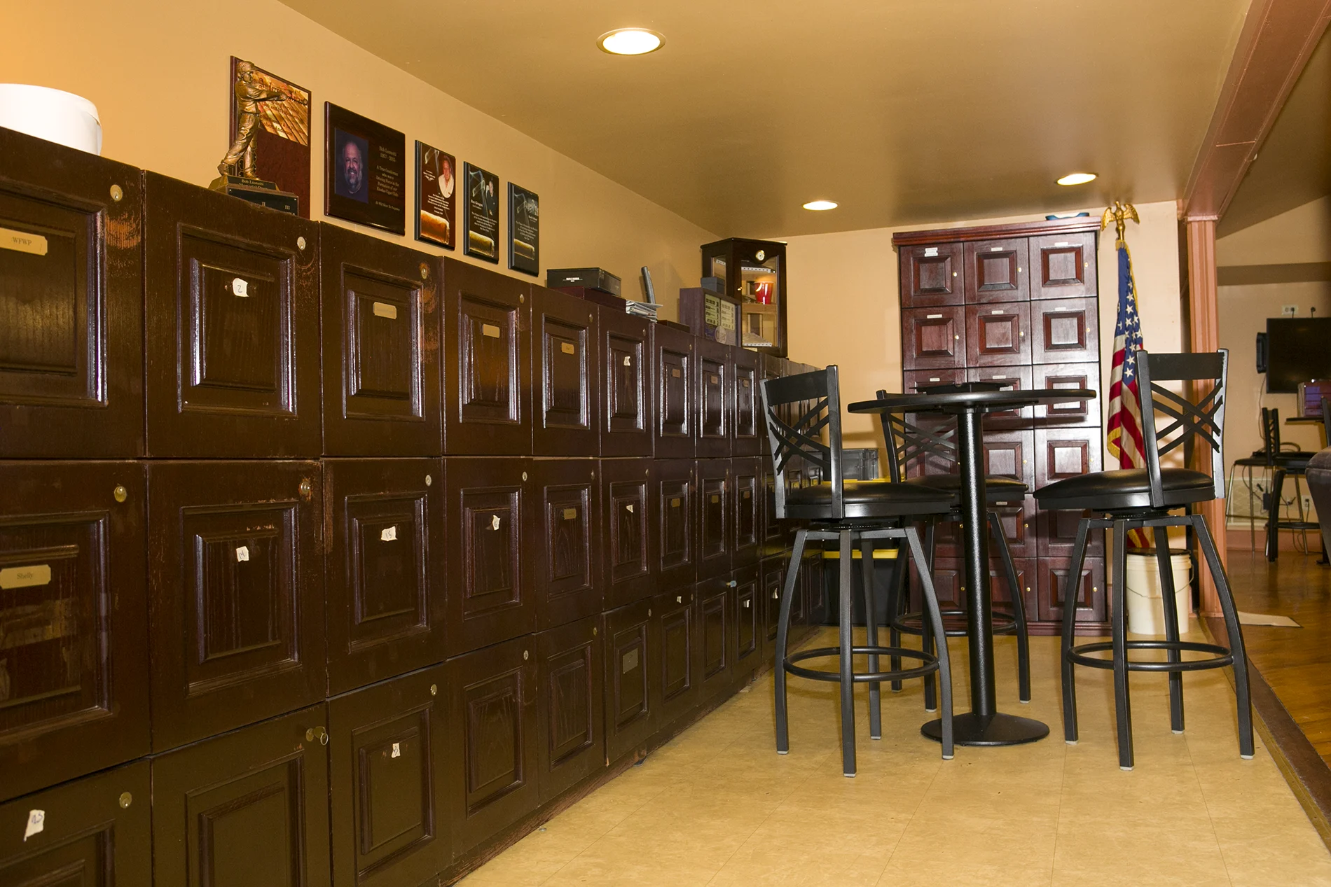 Climate-controlled private cigar lockers with member name plates at Exodus