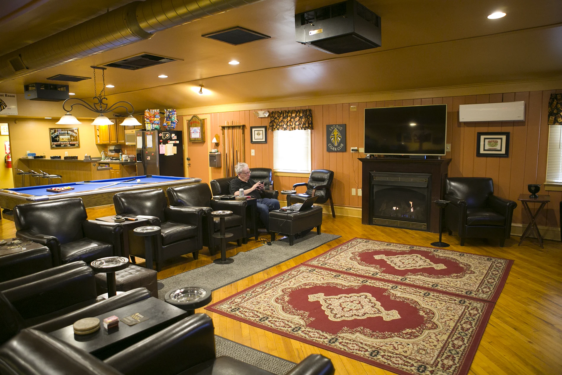 Fireplace seating in the main lounge at Exodus Cigar Lounge